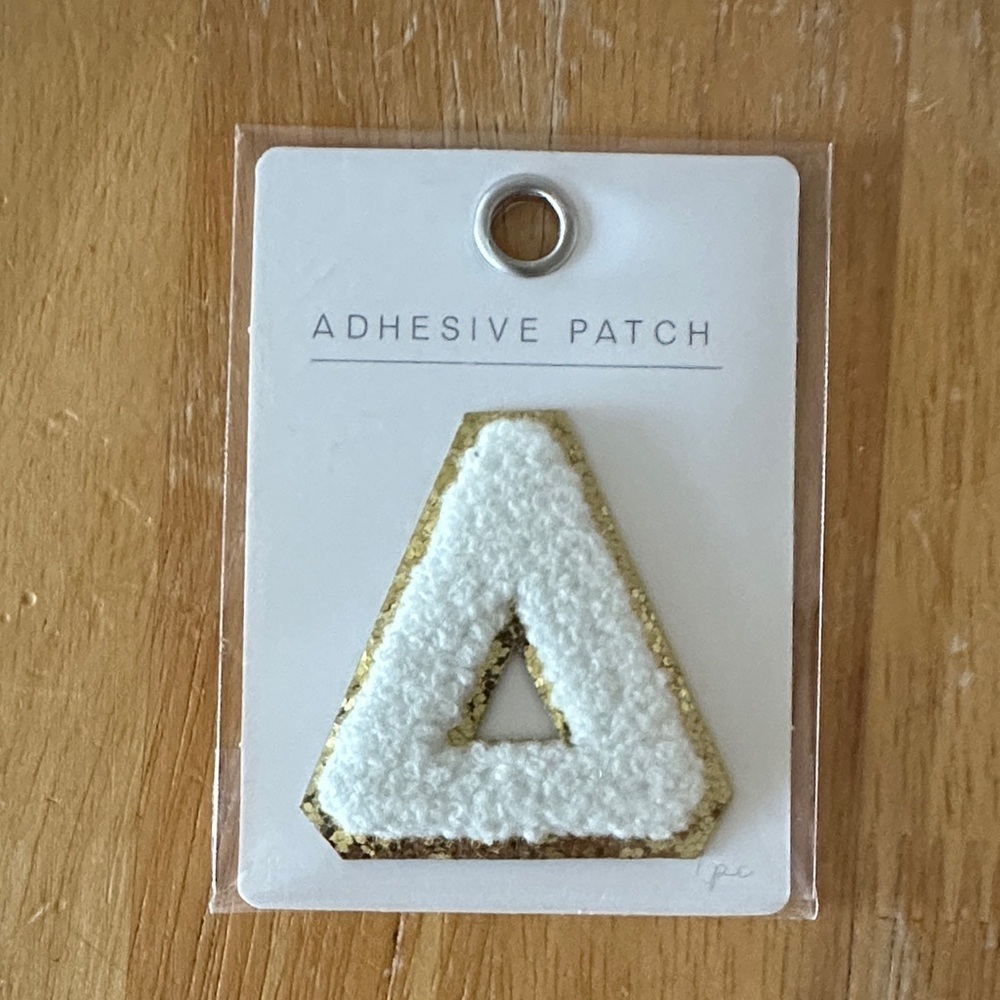 Delta—Gold and White Adhesive Patch